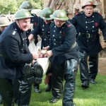 Firemen bring out an injured colleague - John Lee