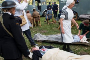 Civilian casualty and injured fireman arrive at the field hospital - John Lee